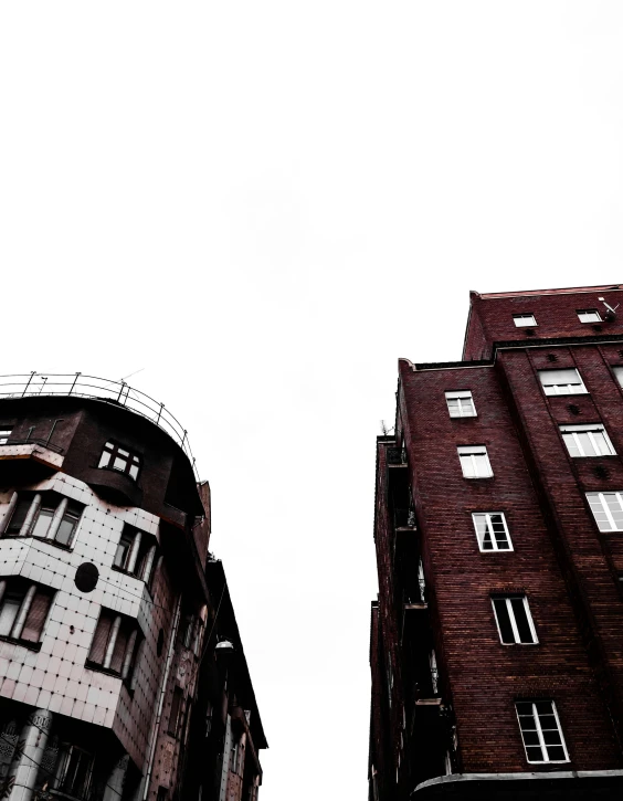 two tall buildings in the middle of an urban area