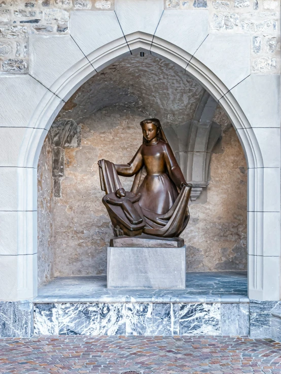 a statue in an arch in the background