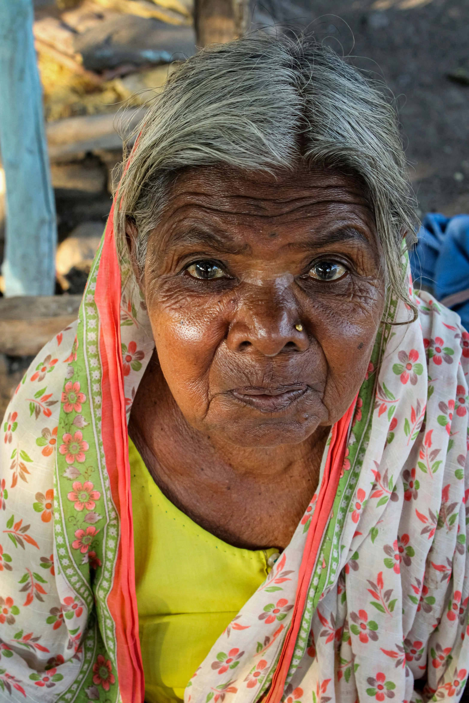 an old woman with no facial expression on her face