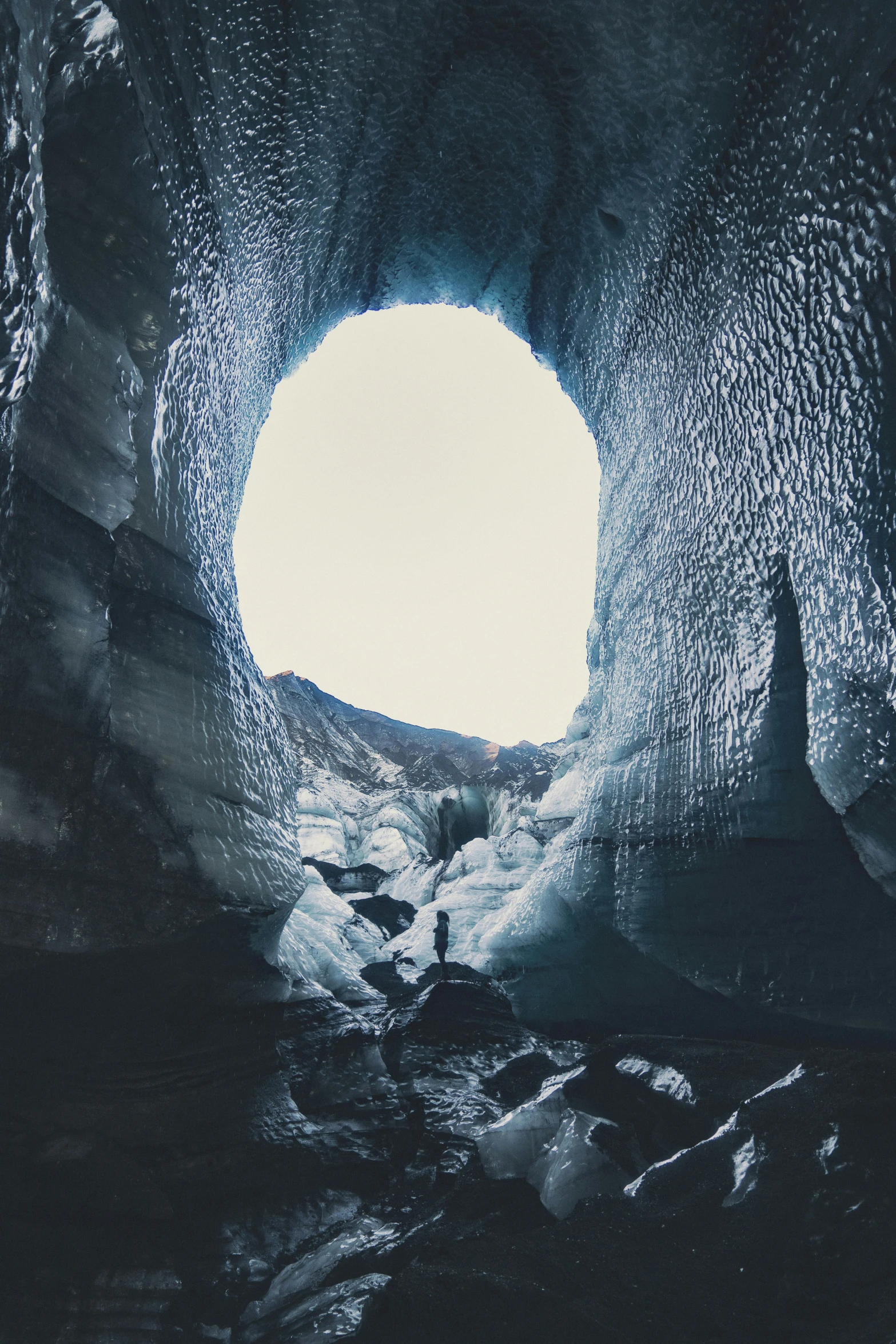 a large open structure with ice chunks around it