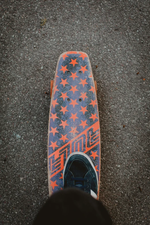 a person standing next to a skate board