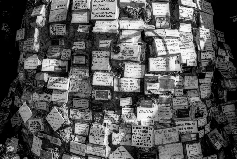 a wall of signs with people and buildings all over it