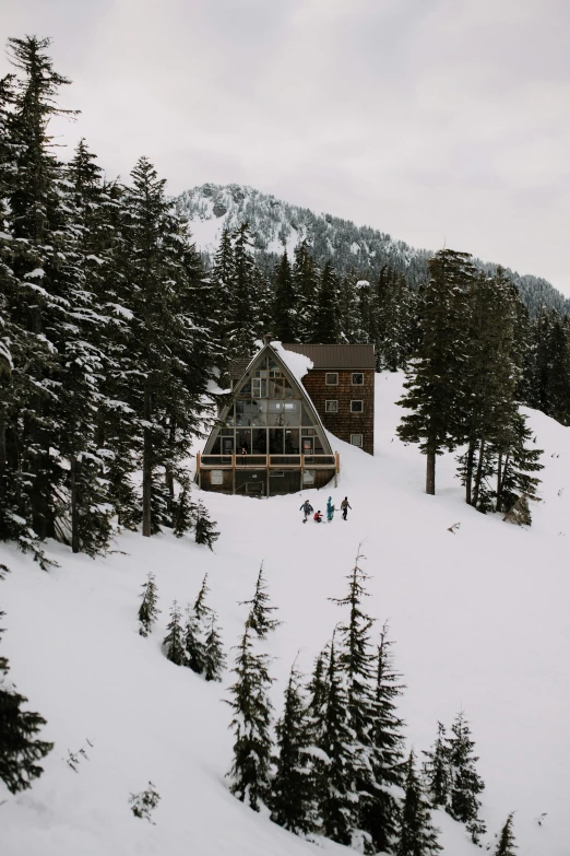 the view from the top of a hill where people ski