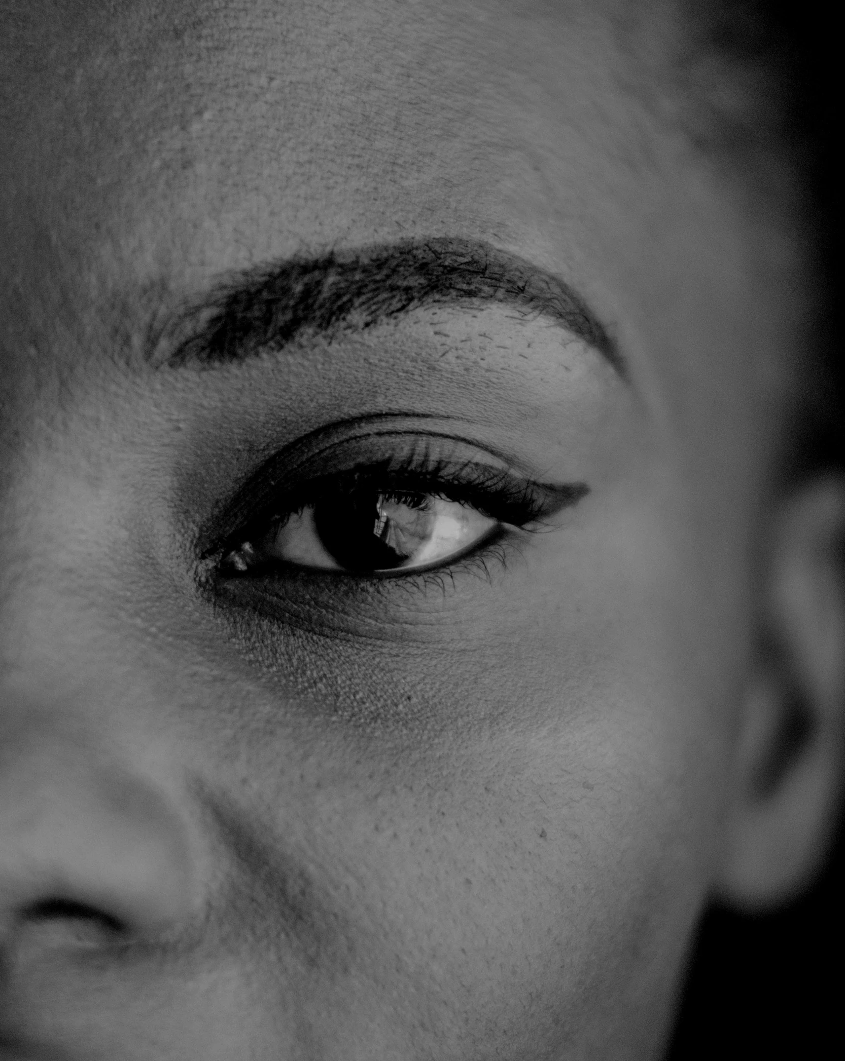 a black and white po of a woman's eyes