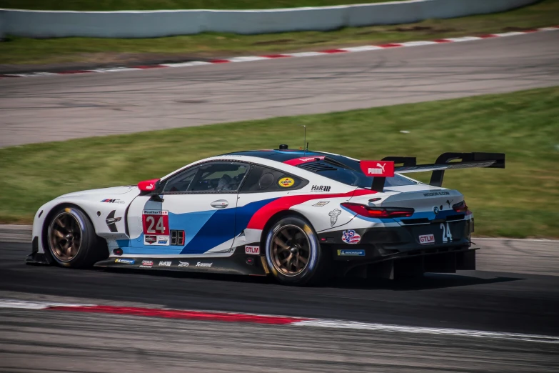 a bmw team car driving on the race track