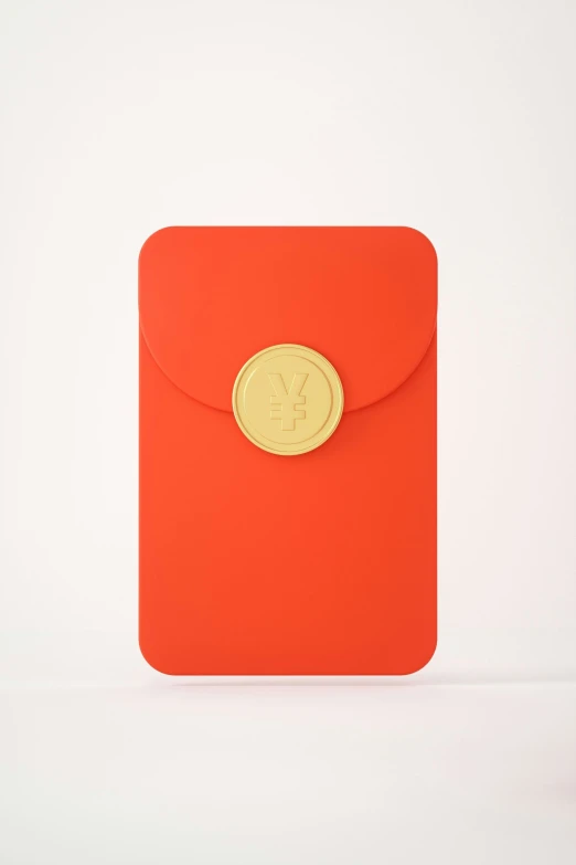 an orange and gold envelope is on the table