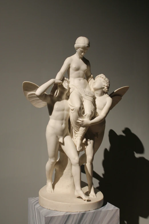 a sculpture with a man and boy playing together