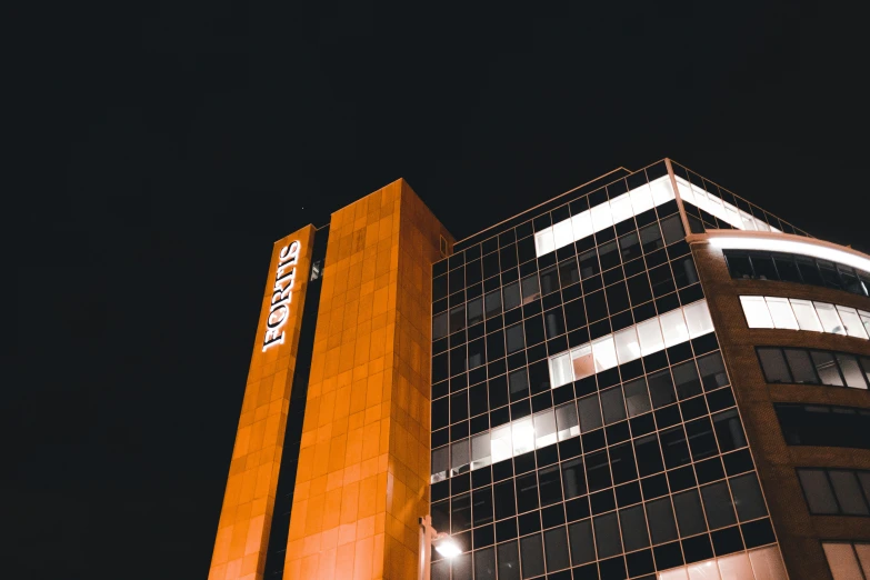 an office building lit up in the night