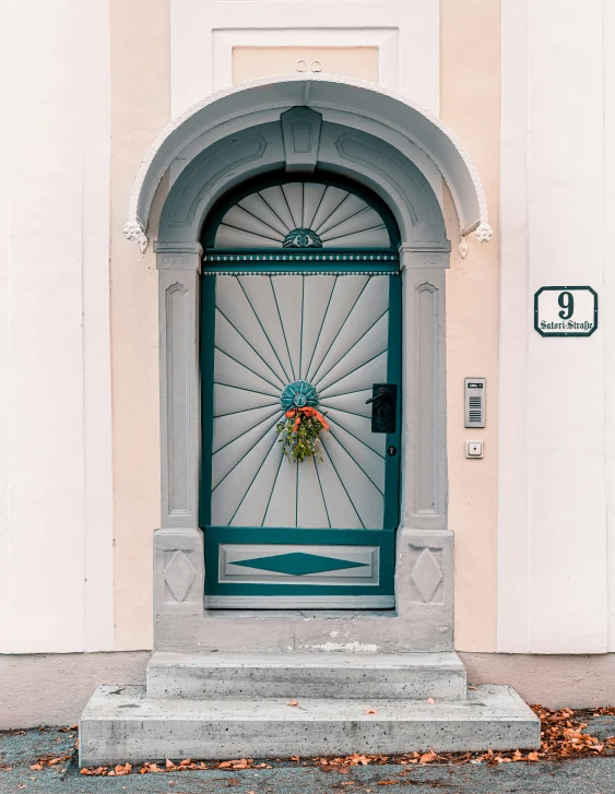 the front door to a building is decorated in grey