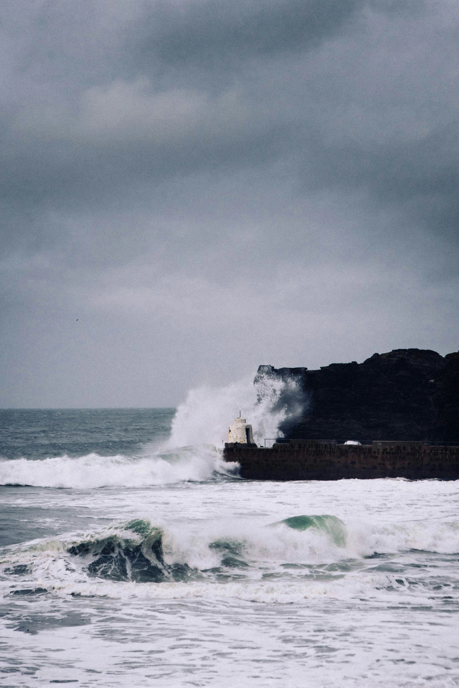 rough waves on the ocean as a boat approaches