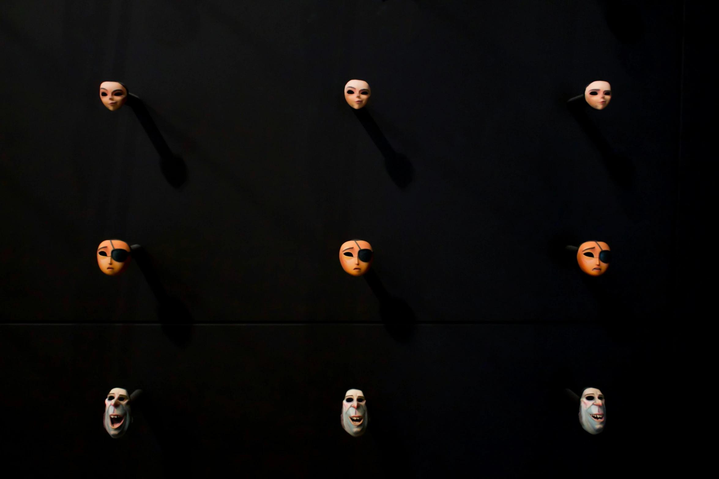 the wall is lined with different masks to show off on it