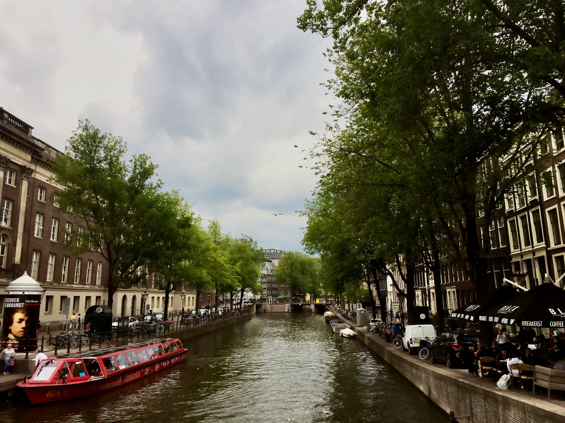 the boats are passing through the canal near the buildings