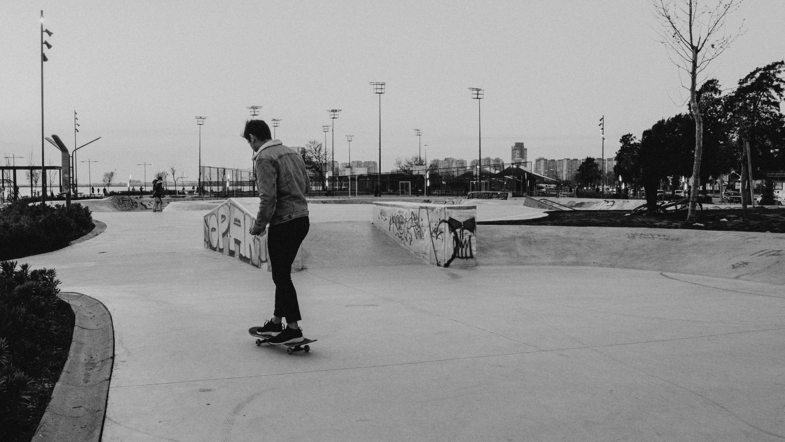 the boy is riding his skateboard in the park