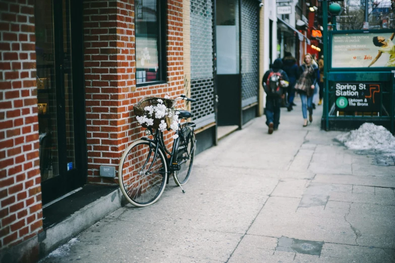 there is a bike parked on the side walk