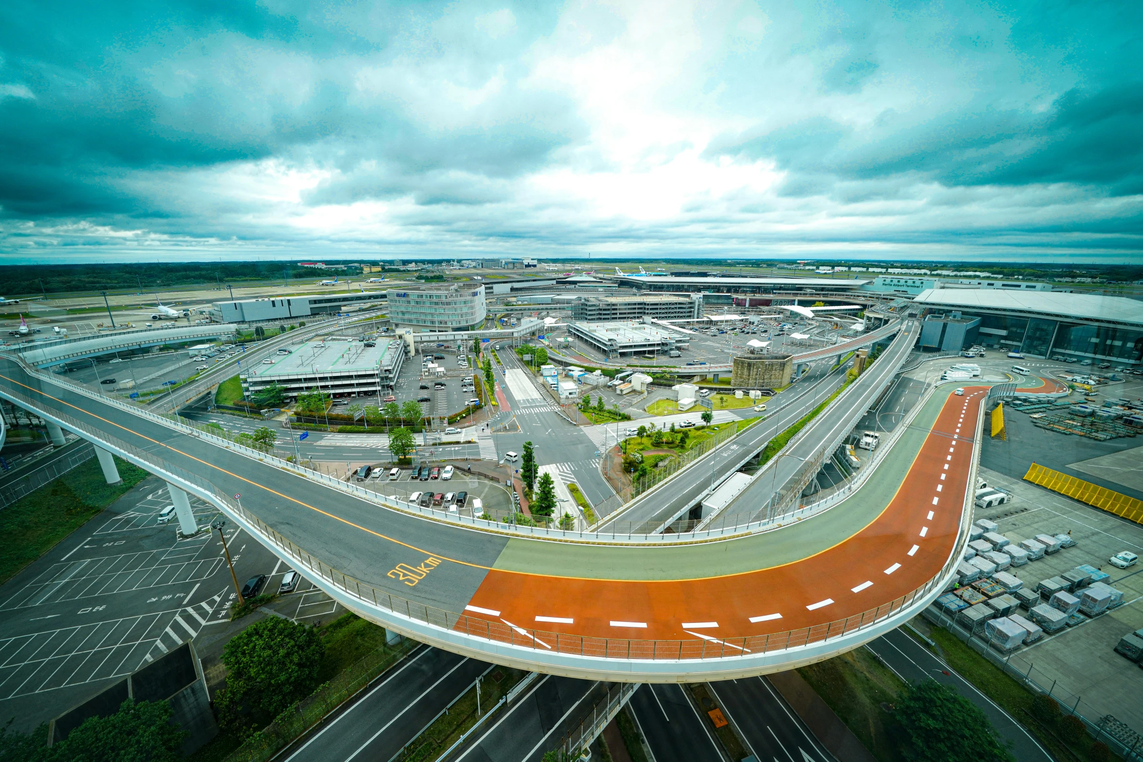 aerial view of street intersection under stormy skies