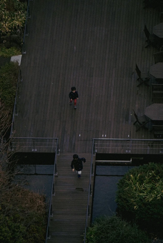 an aerial s of a person standing on top of steps