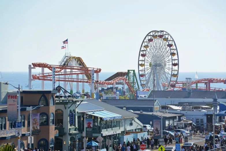 a large ferris wheel towering over a city