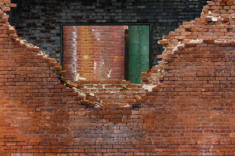 a brick building with a green door and window