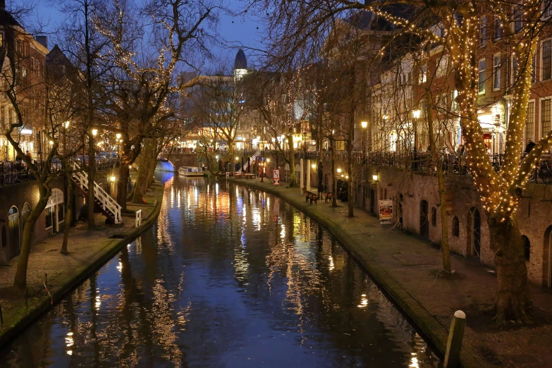 a night scene looking down the river in a city