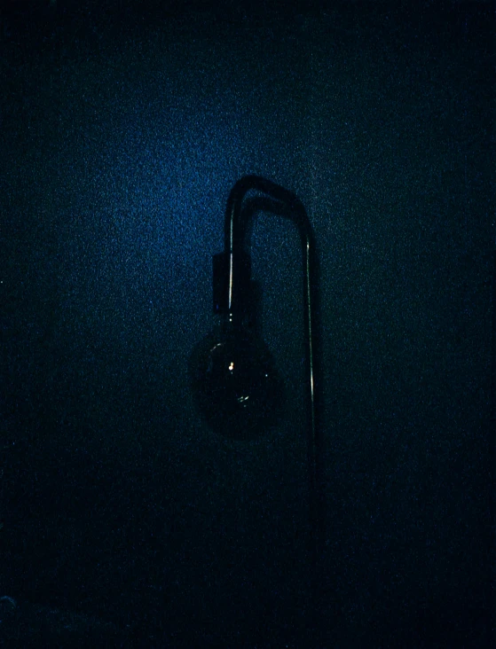 a glowing lightbulb against a dark wall