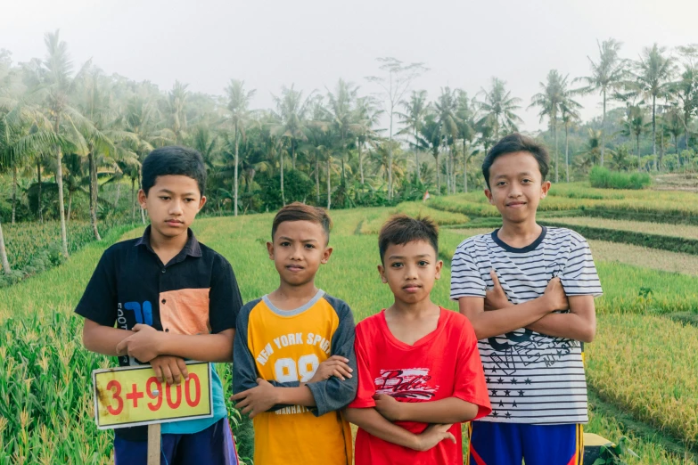 several s standing in front of the camera on a hill