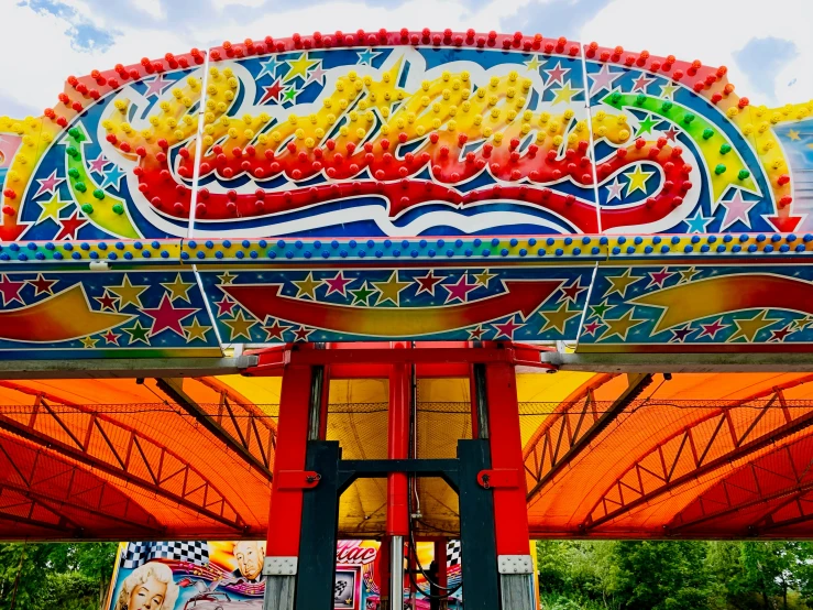 large colorful archway on top of ride covered with canopy