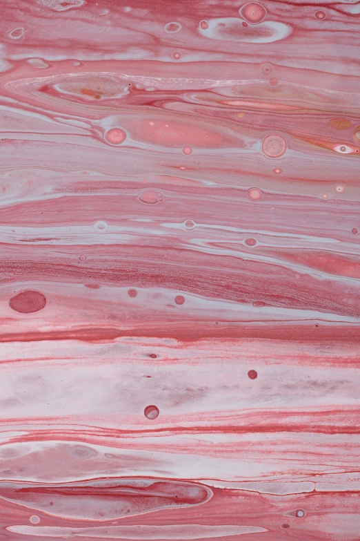 a close up view of a red background with lots of bubbles