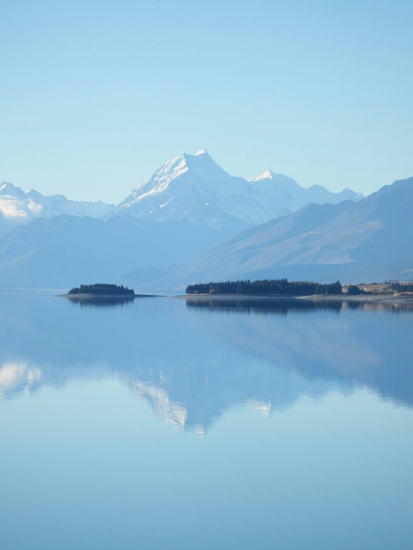 a view of a beautiful lake that's surrounded by mountains