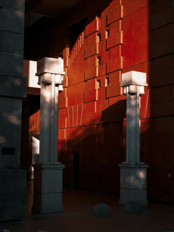 two white pillars and some bricks outside