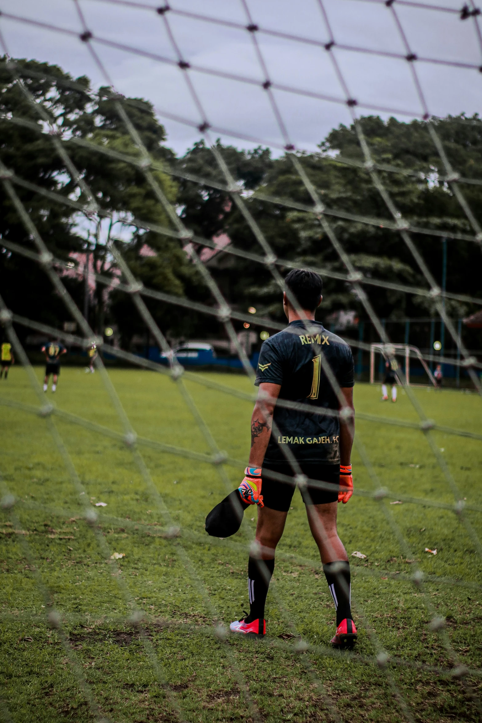 a player stands with his foot on the field