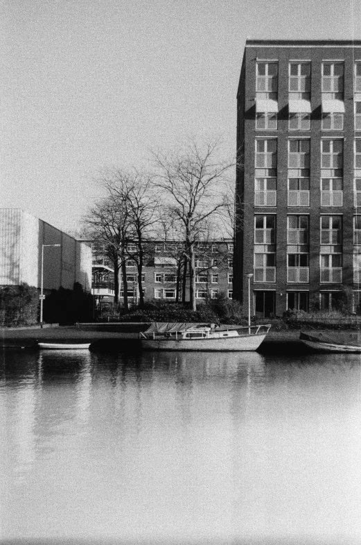 a couple of boats in the water near buildings