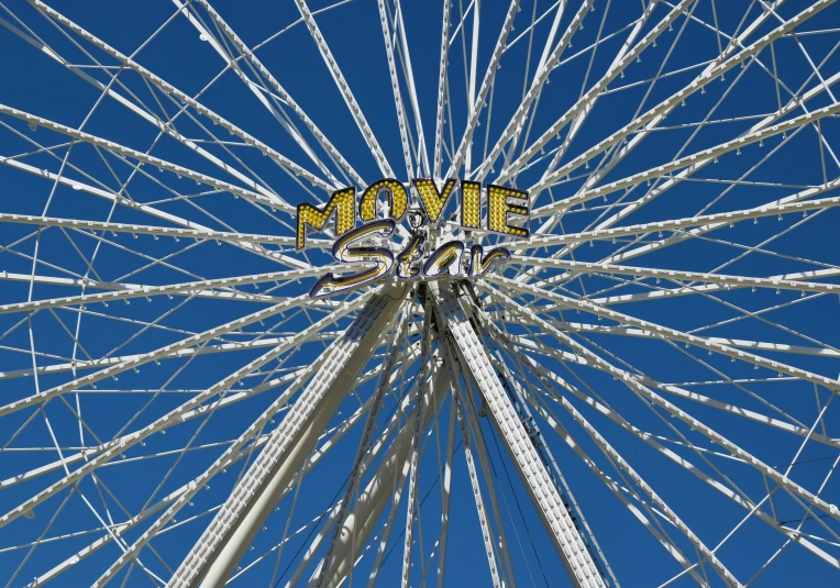 a ferris wheel with a welcome sign on top