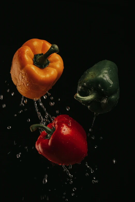 tomatoes and peppers are splashing in the water