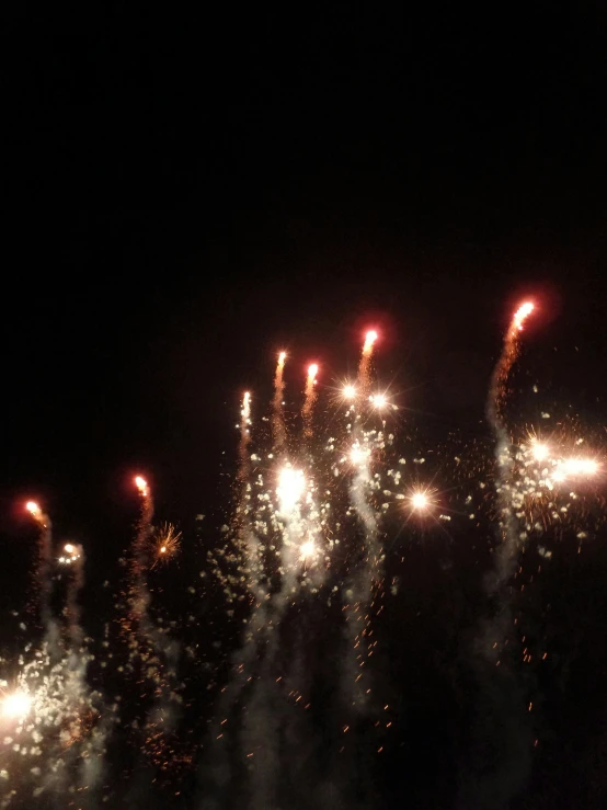 an artistic view of fireworks on the water