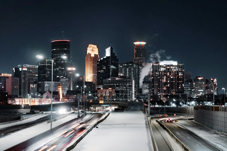 a city skyline lit up with lights at night