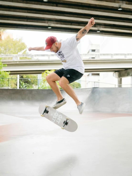 a person is flying through the air with a skateboard