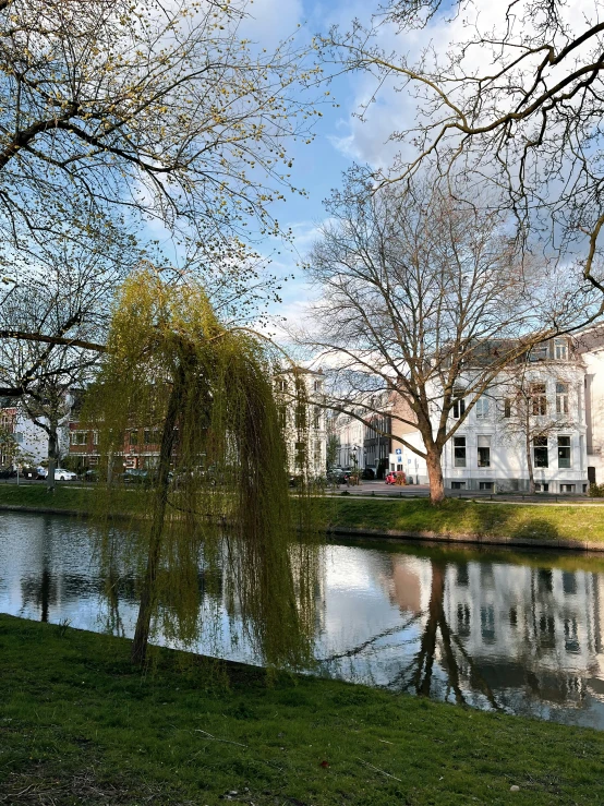 a river runs next to a large white building