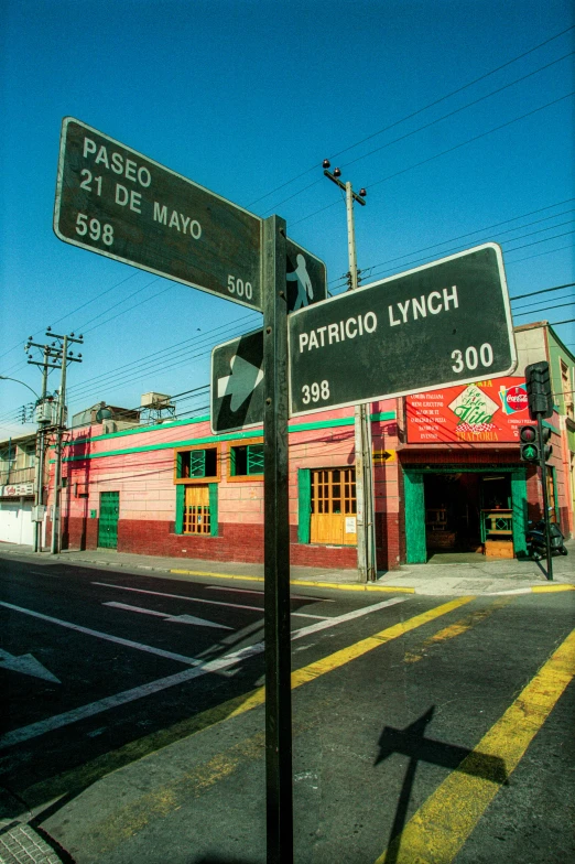 a large street sign on top of a metal pole