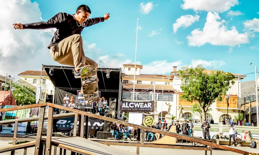 a man flying through the air on top of a skateboard