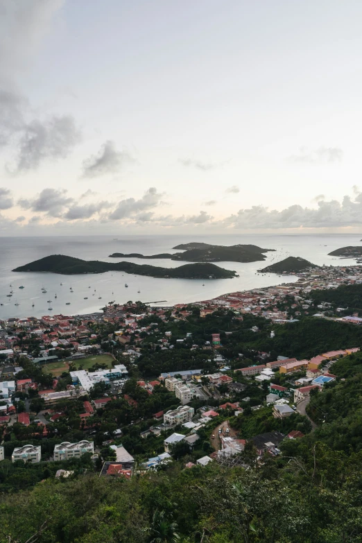 a town sits in the ocean and there are several small islands