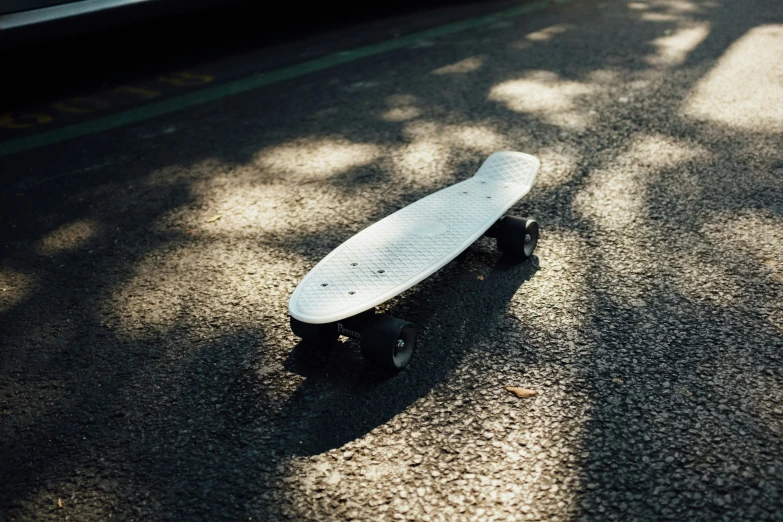 a skateboard sitting in the middle of the road