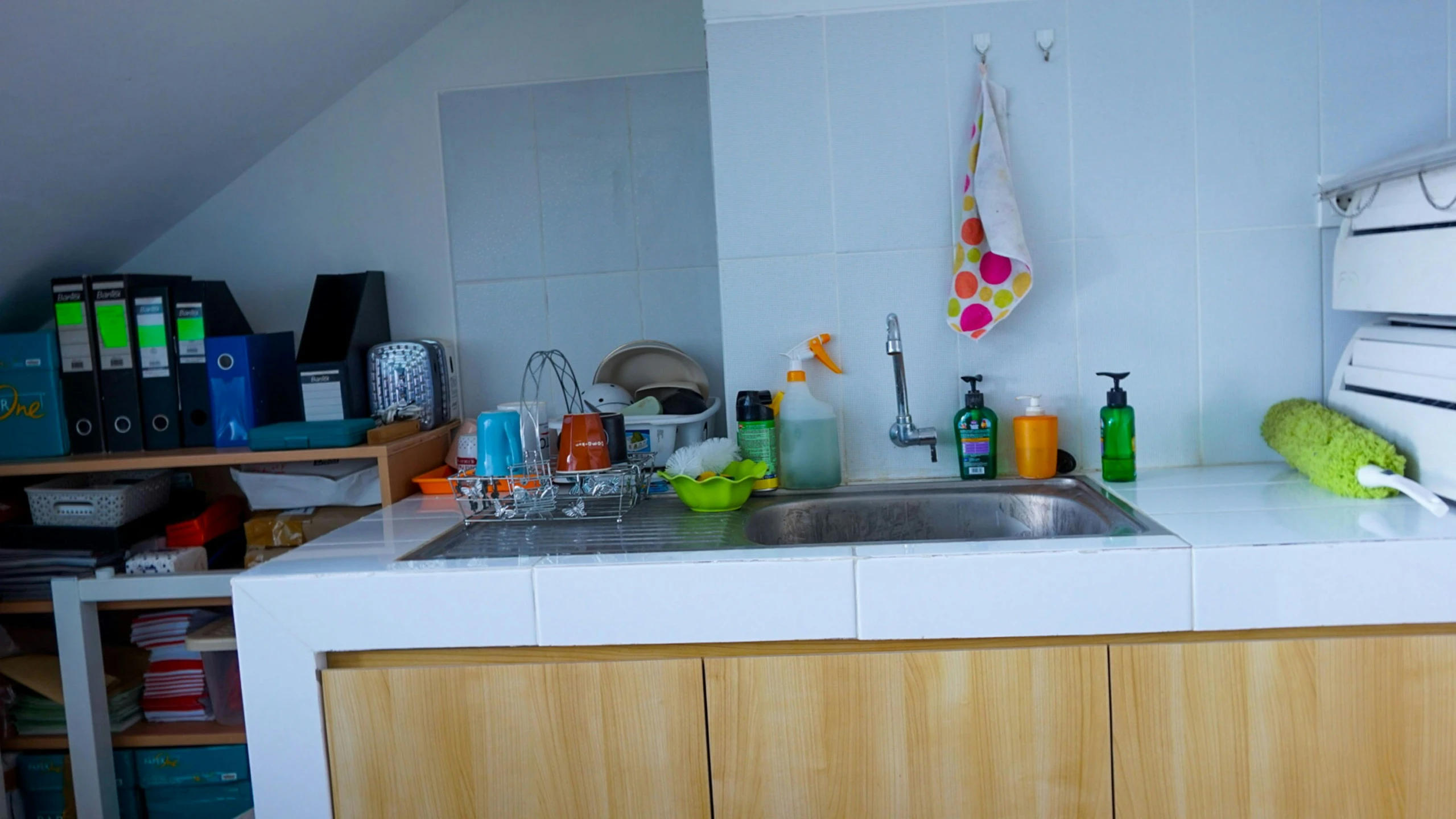 the kitchen counter has many bottles on it