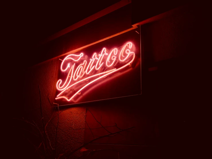 a baseball player illuminated sign on the side of a building