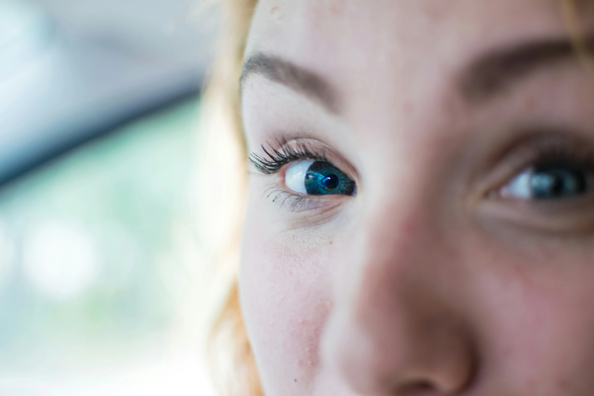 the woman's eye has very bright blue colors