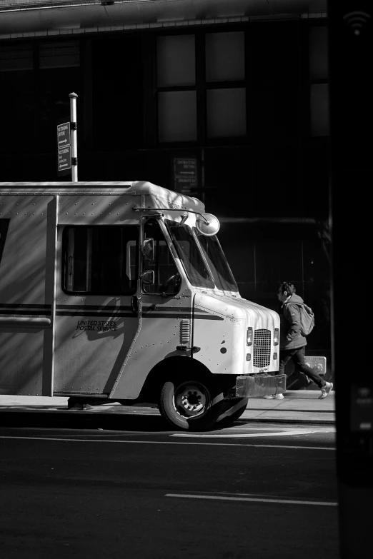 an old fashioned ice cream truck sitting next to a building
