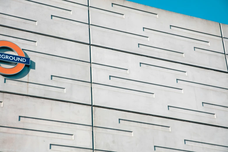 a white and orange building next to a sign