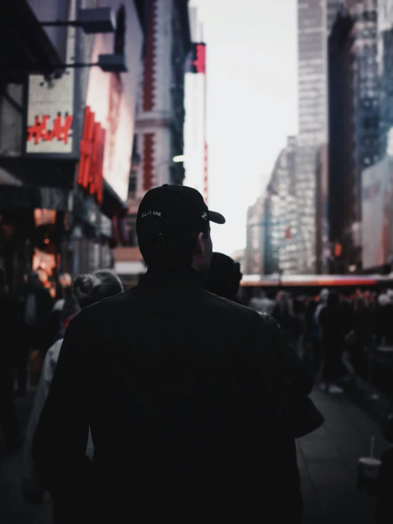 a man walking down a city street in the daytime