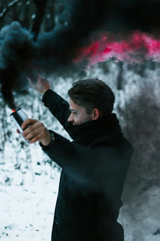 a man holding an object with a blurry background