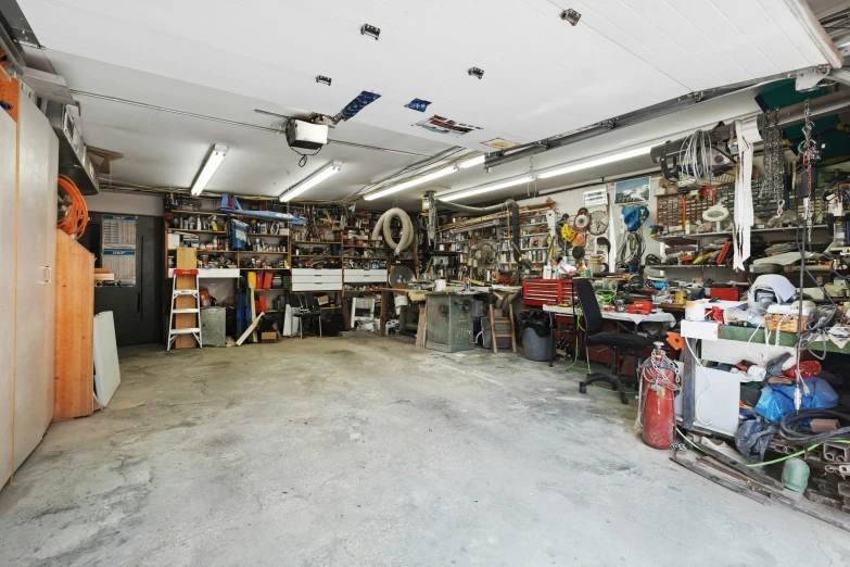 a garage filled with items and boxes inside of it