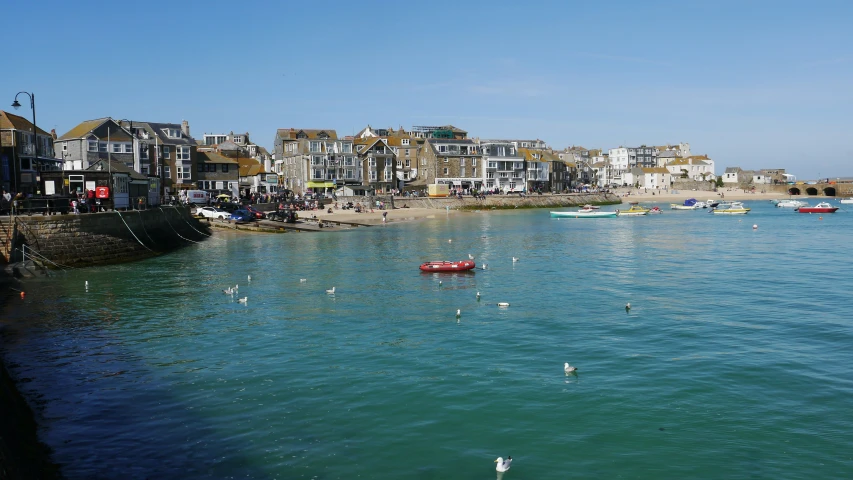 the water is very clear and blue for boats